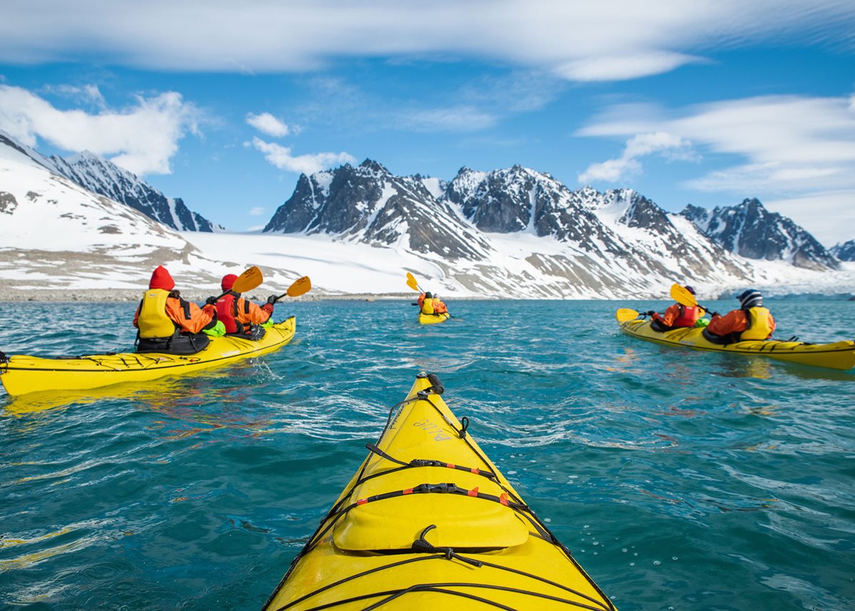 Kayaking the Magdalenefjorden coastline in Norway with Silversea Expeditions.