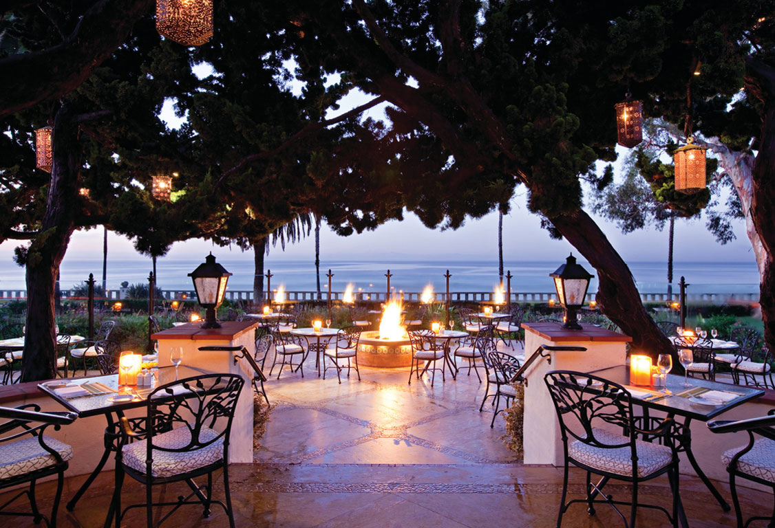 Evening settles on the Bella Vista dining patio at the Four Seasons Resort the Biltmore Santa Barbara.